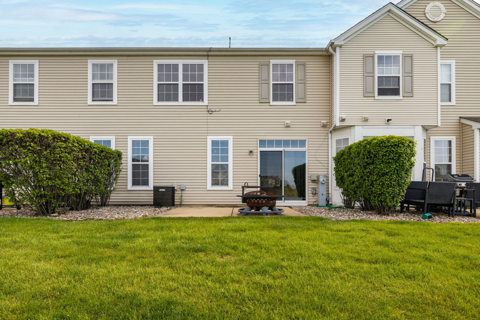 15340 Kenmare Circle Manhattan, IL 60442 - Photo 19 of 19 a front view of a house with a yard and sitting area