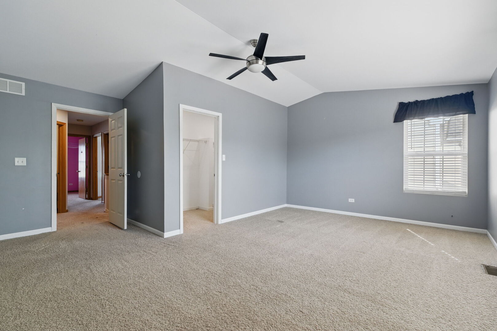 15340 Kenmare Circle Manhattan, IL 60442 - Photo 8 of 19 a view of an empty room with a ceiling fan