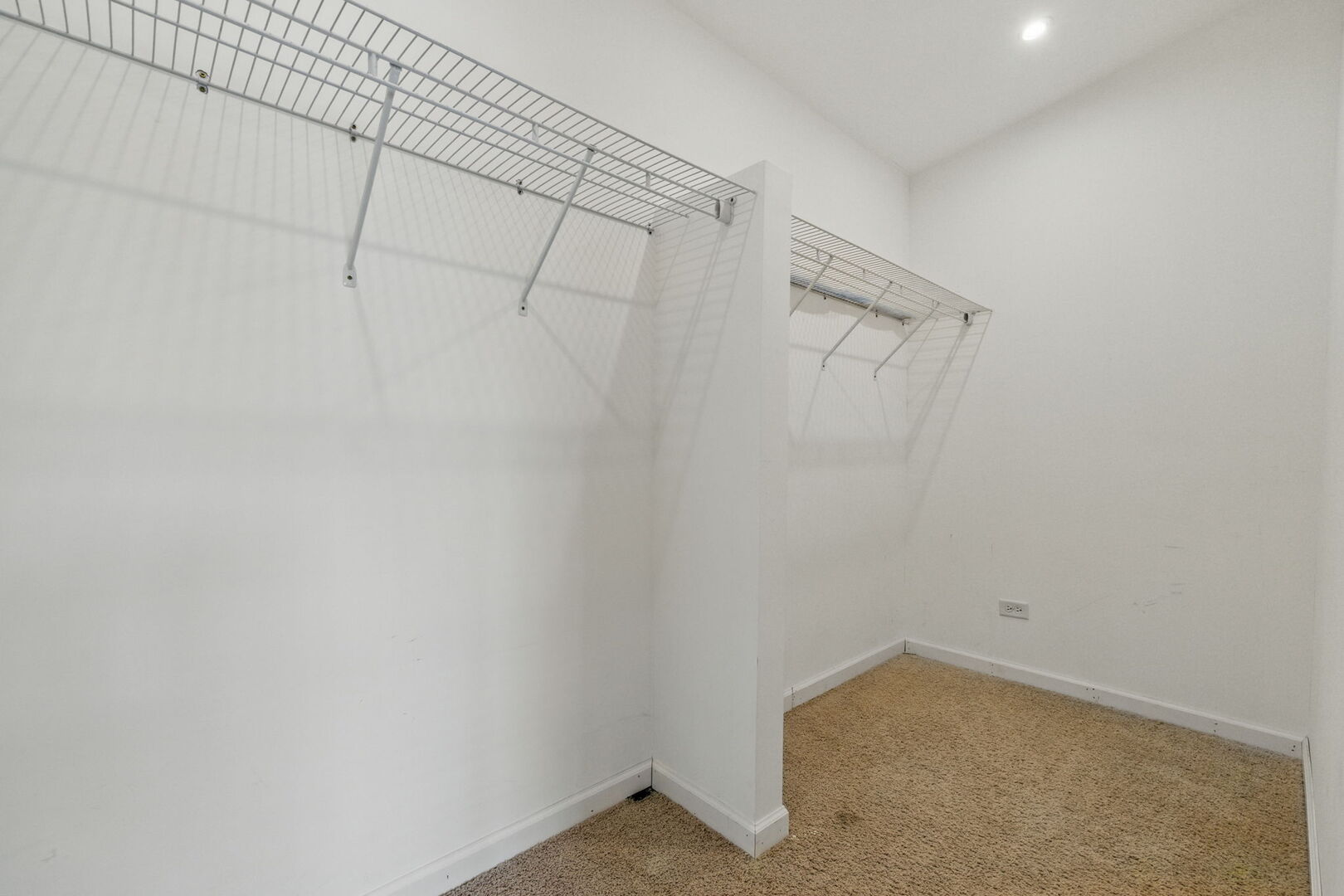 15340 Kenmare Circle Manhattan, IL 60442 - Photo 10 of 19 a view of a room with racks on the wall