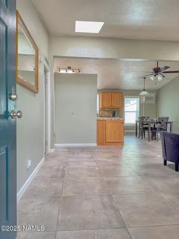 a bathroom with a double vanity sink toilet mirror and shower