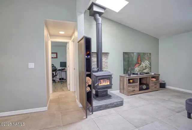 a kitchen with kitchen island a sink stove and refrigerator