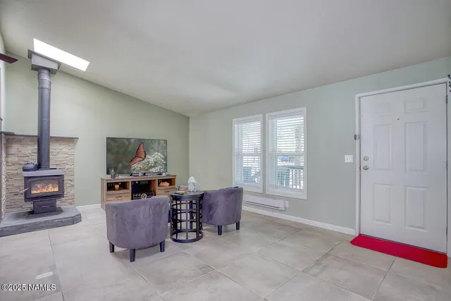 a kitchen with stainless steel appliances granite countertop a stove and a microwave