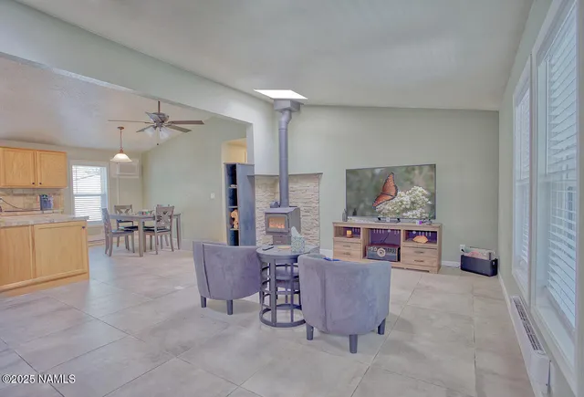 a bedroom with a bed and ceiling fan