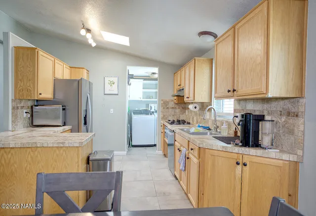 a view of a room that has a table and chair