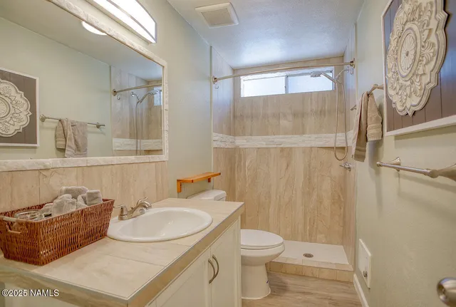 a workspace with wooden floor and a window