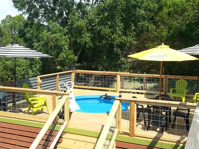 a view of a swimming pool with a patio