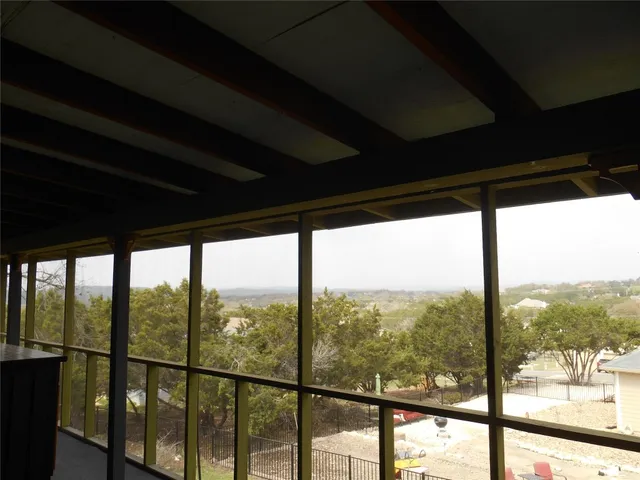 a living room with furniture a patio outdoor seating and a table