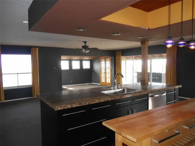 a kitchen with sink and stove