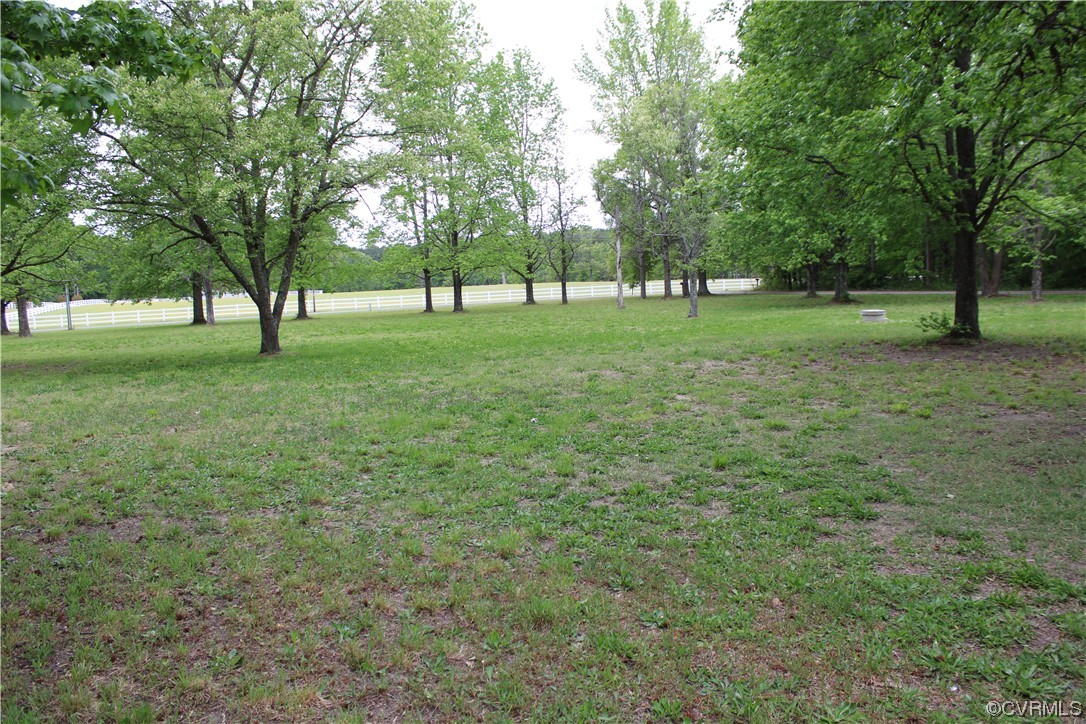 19577 Templeton Road Carson, VA 23830 - Photo 14 of 16 a view of grassy field with benches and trees all around