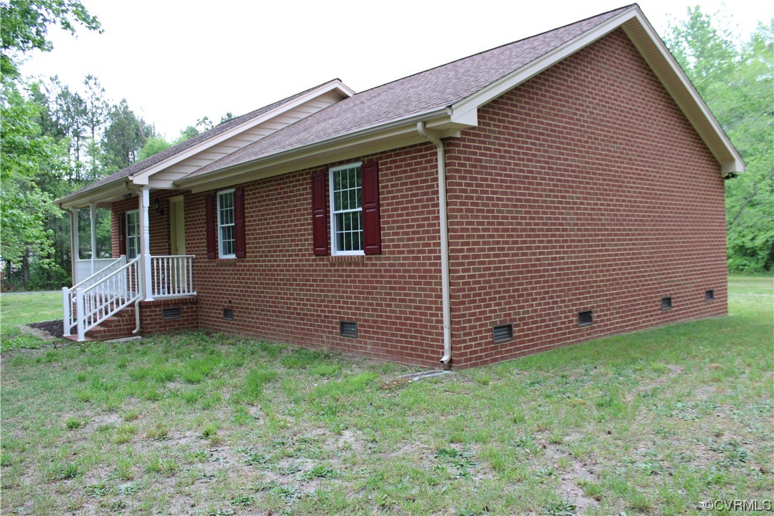 19577 Templeton Road Carson, VA 23830 - Photo 16 of 16 a view of a backyard with a garden