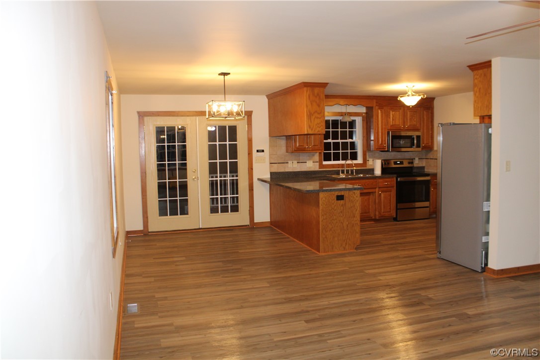 19577 Templeton Road Carson, VA 23830 - Photo 3 of 16 a kitchen with stainless steel appliances granite countertop a stove and a refrigerator