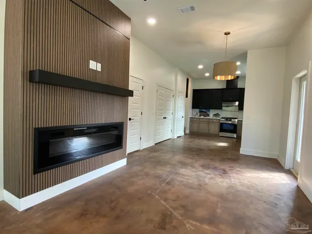 a view of kitchen and kitchen with fireplace