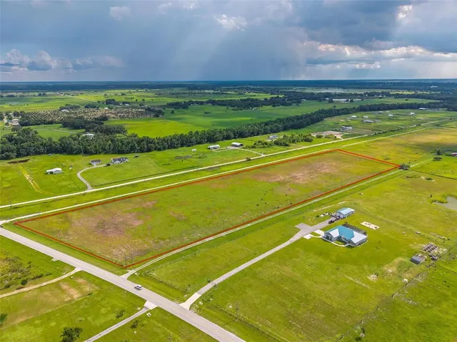 a view of an outdoor space and basketball court