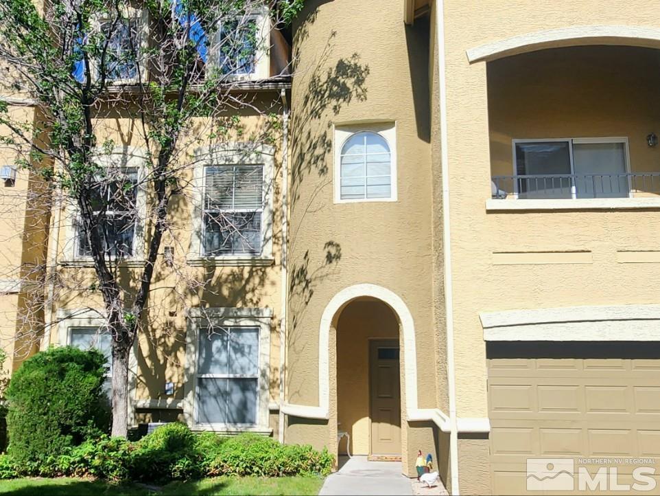 9050 Double R Boulevard, Unit 1124 Reno, NV 89521 - Photo 1 of 40 a front view of a house with large windows