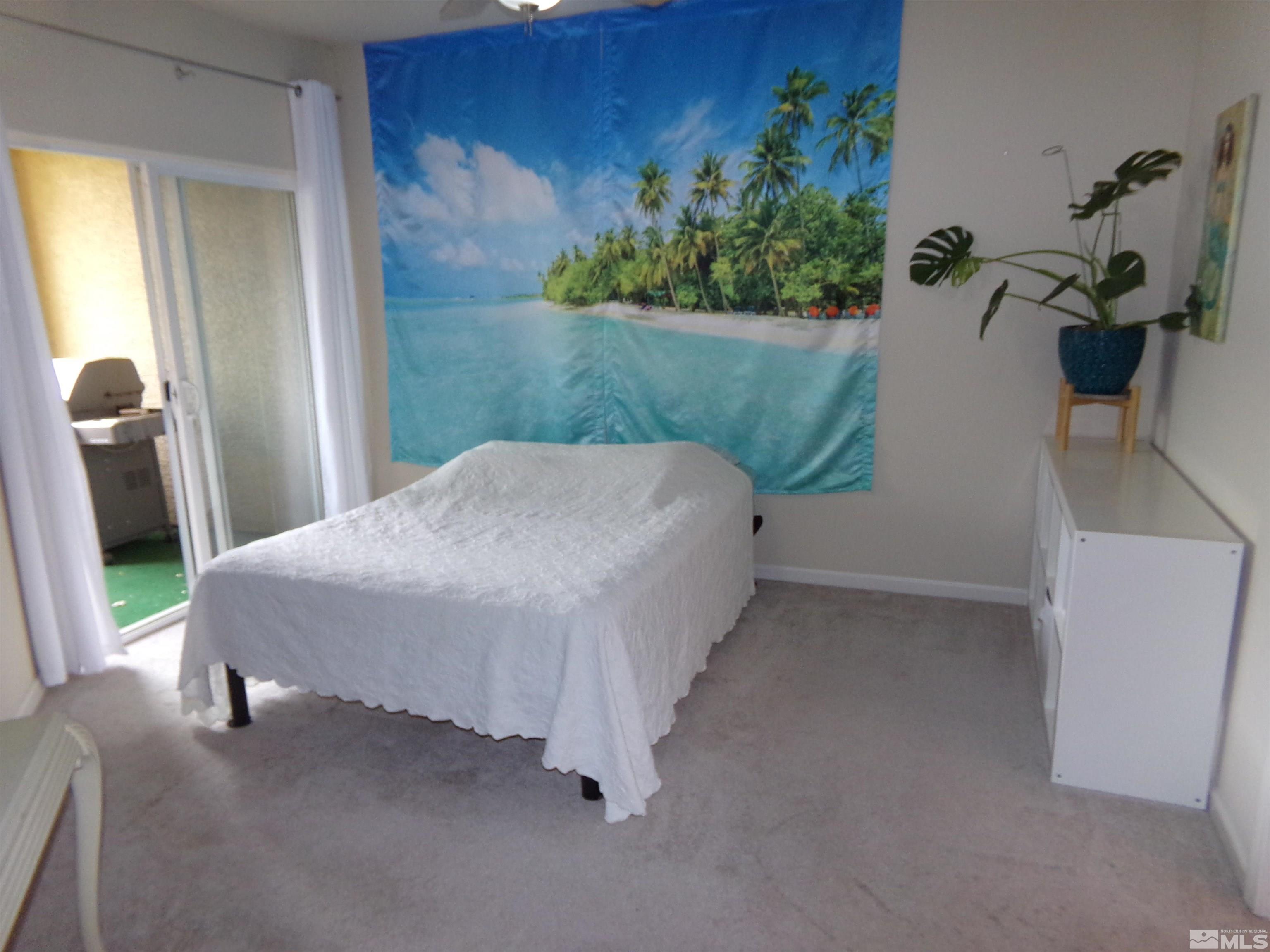 9050 Double R Boulevard, Unit 1124 Reno, NV 89521 - Photo 20 of 40 a bed sitting in a bathroom next to a window