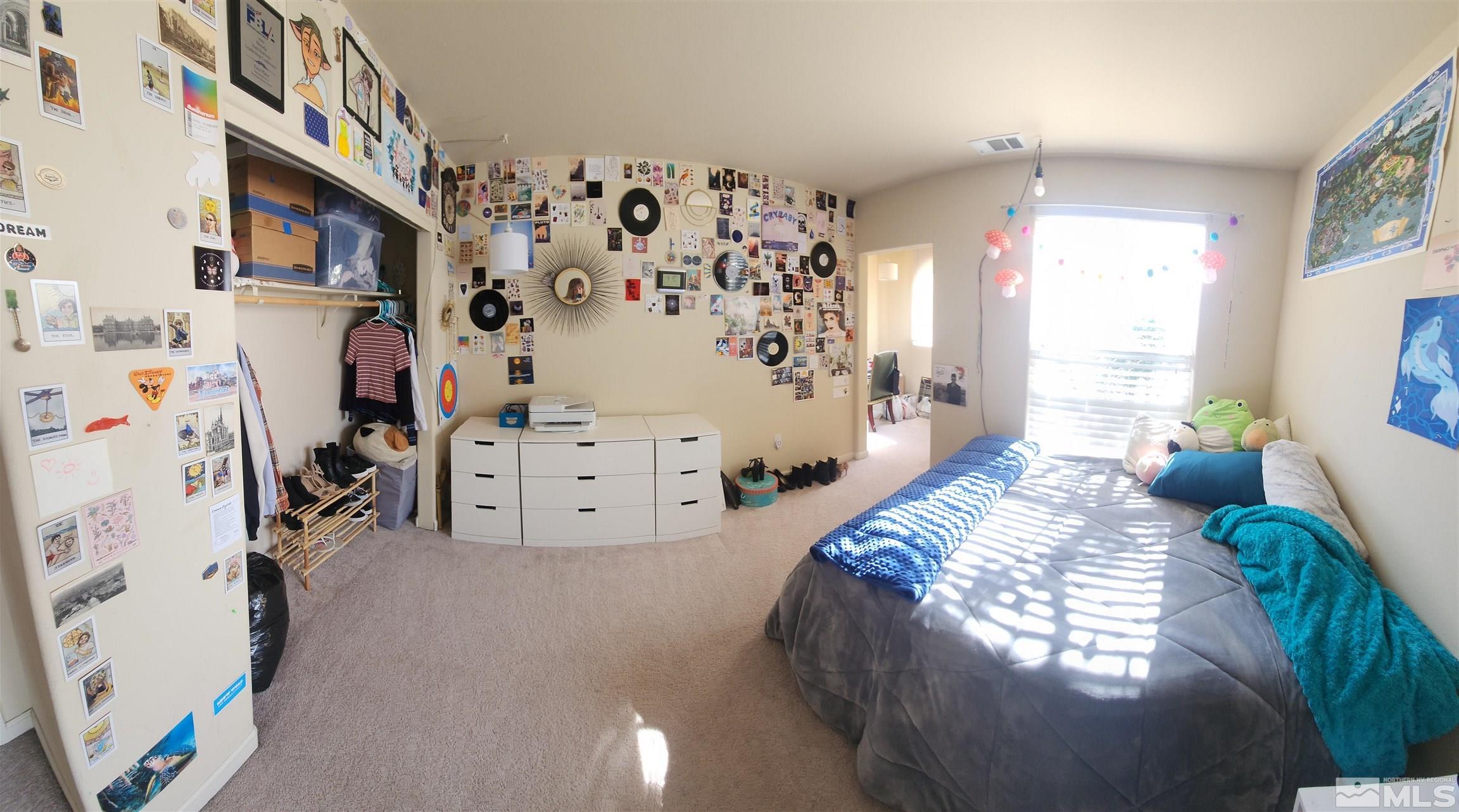 9050 Double R Boulevard, Unit 1124 Reno, NV 89521 - Photo 22 of 40 a bedroom with a bed and a window