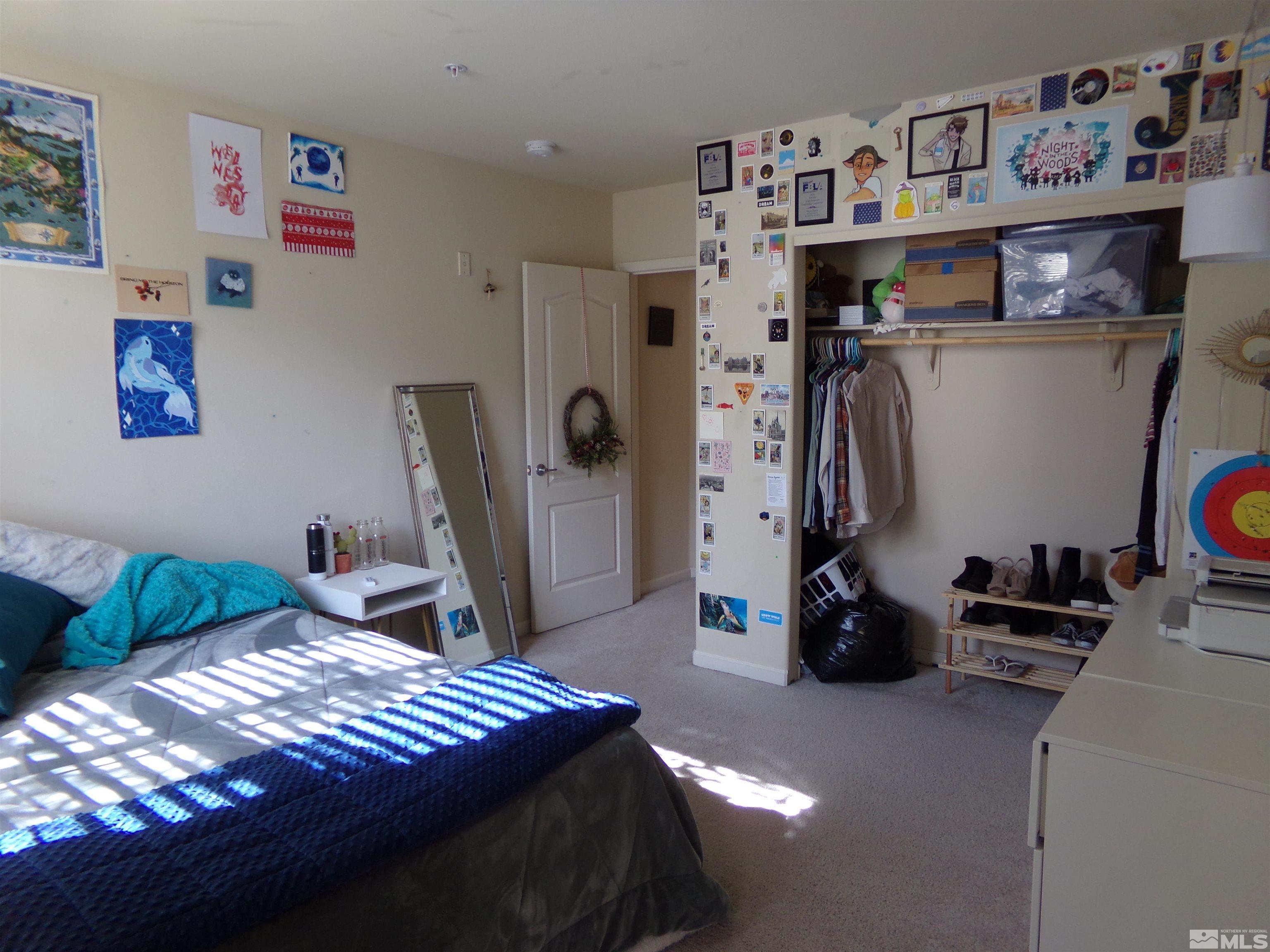 9050 Double R Boulevard, Unit 1124 Reno, NV 89521 - Photo 26 of 40 a bedroom with bed and a closet