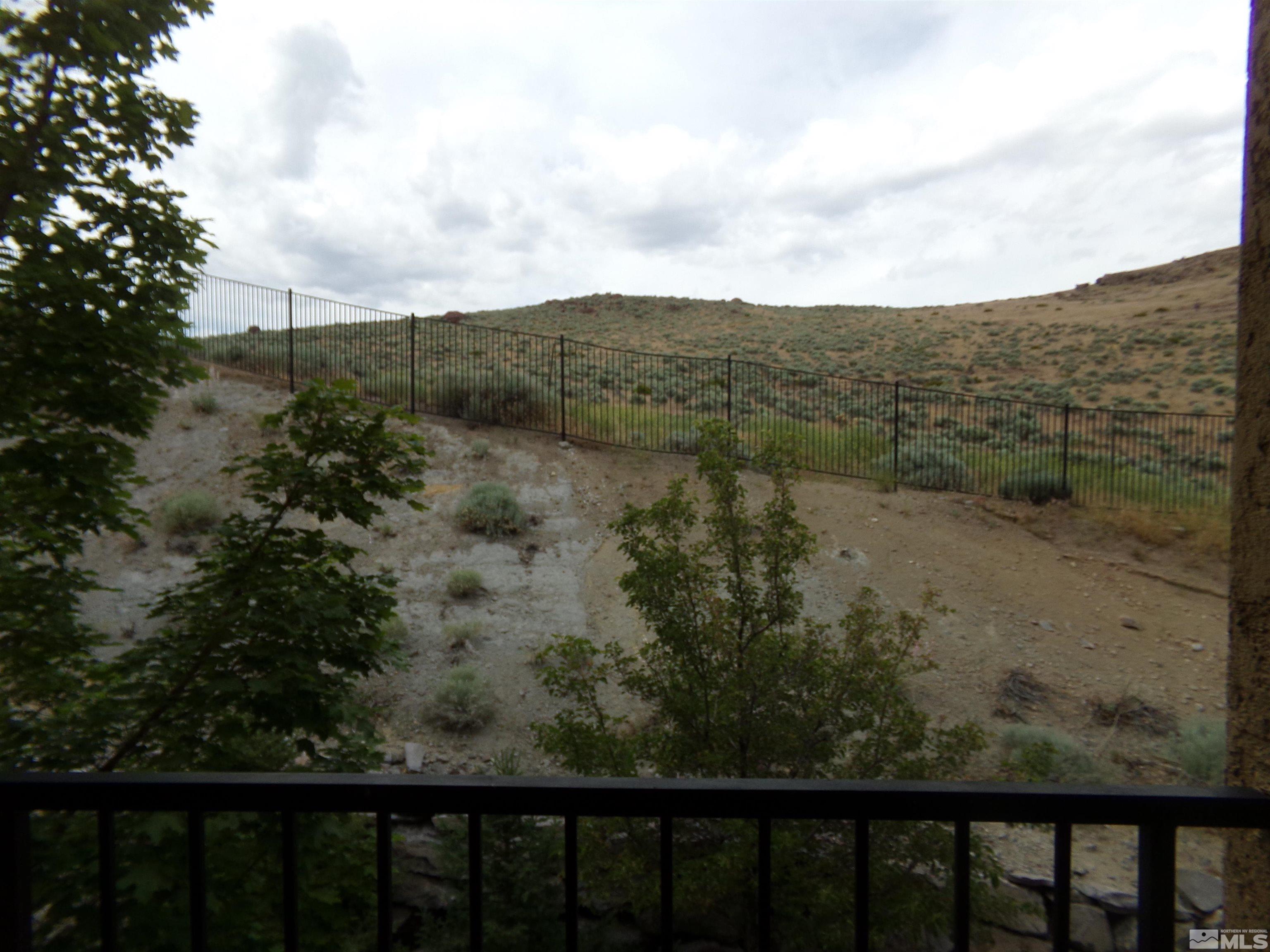 9050 Double R Boulevard, Unit 1124 Reno, NV 89521 - Photo 28 of 40 a view of a forest with a mountain