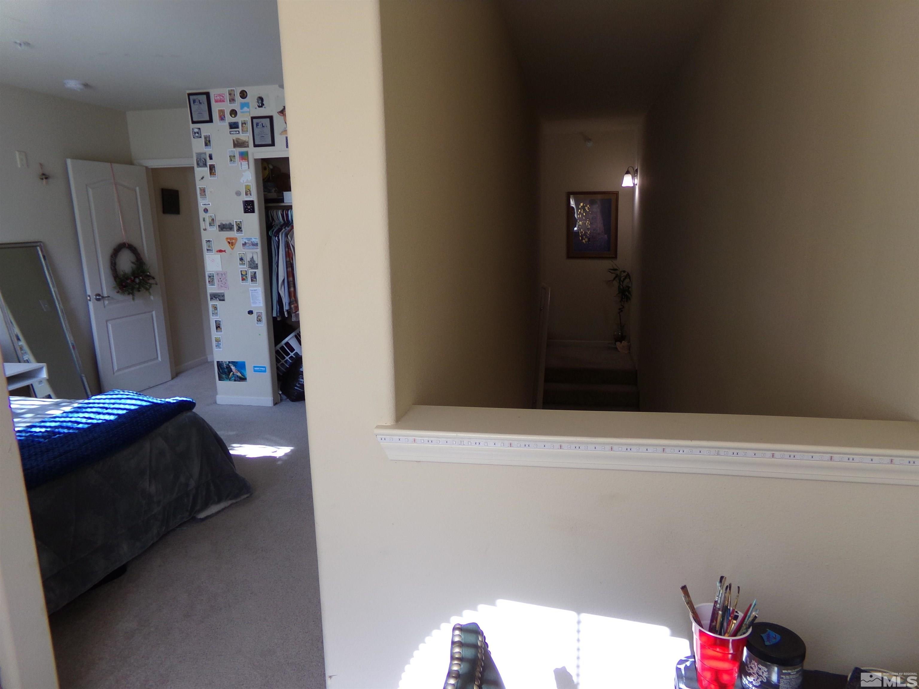 9050 Double R Boulevard, Unit 1124 Reno, NV 89521 - Photo 31 of 40 a bedroom with a bed and a window