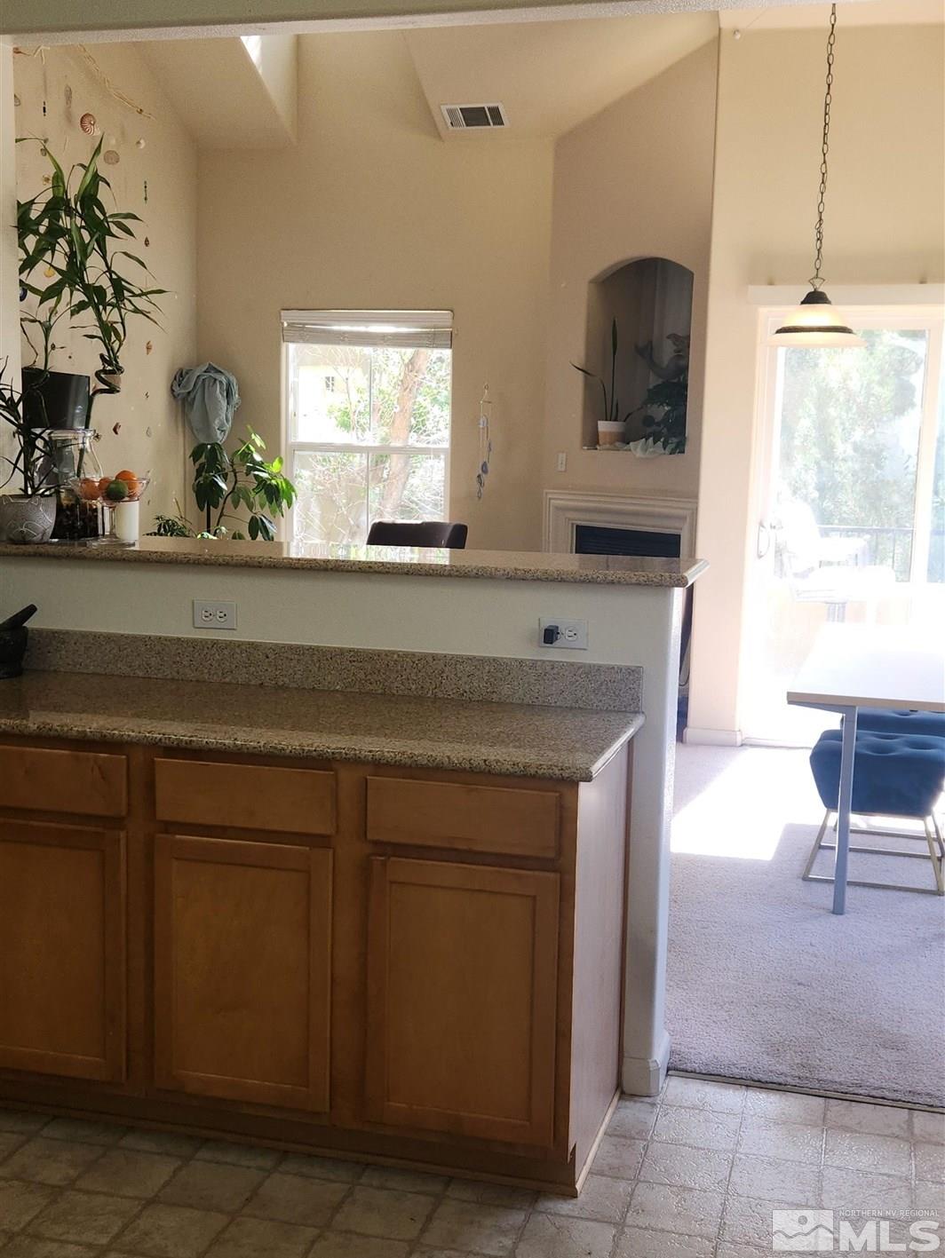9050 Double R Boulevard, Unit 1124 Reno, NV 89521 - Photo 38 of 40 a kitchen with a sink and a refrigerator