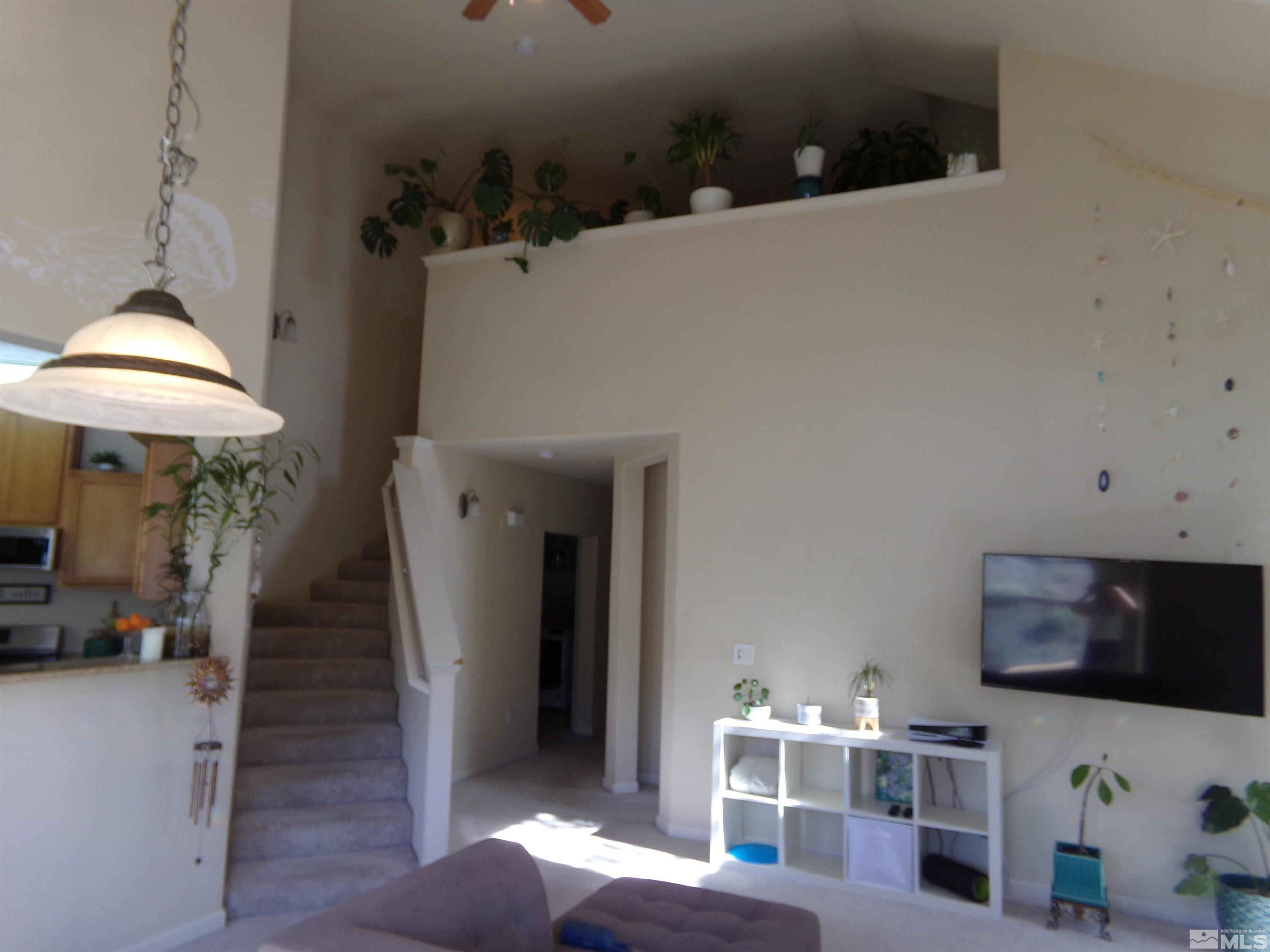 9050 Double R Boulevard, Unit 1124 Reno, NV 89521 - Photo 8 of 40 a workspace with furniture and a fireplace