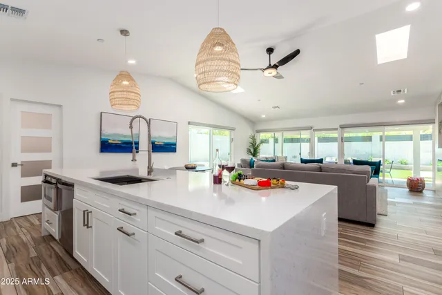 a view of a kitchen counter space and breakfast area