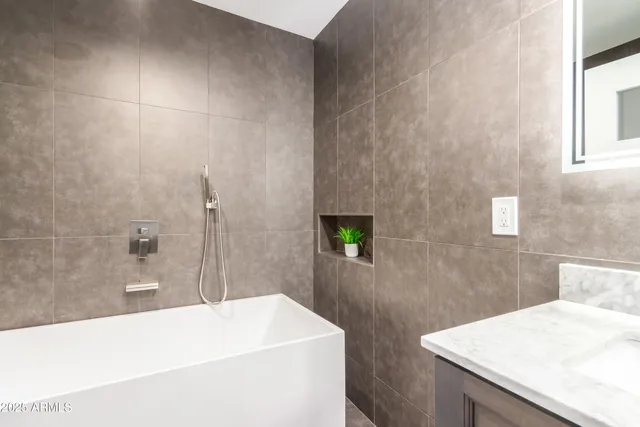 a bathroom with a sink and a bathtub