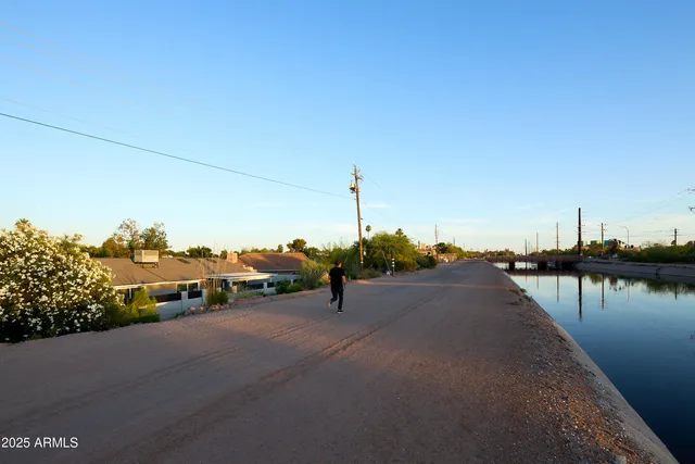 a picture of a lake with a houses