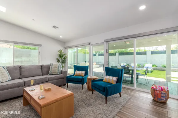 a living room with furniture and a large window