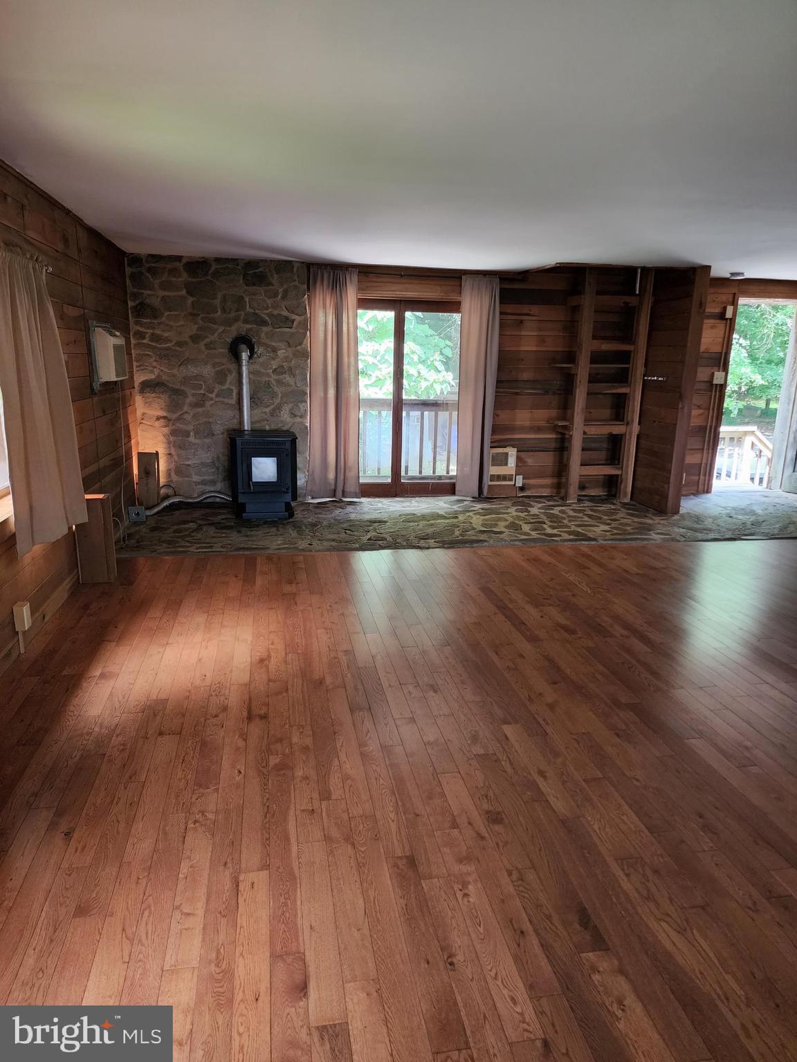 9625 Hoffman-Seachrist Road, Unit C Frederick, MD 21701 - Photo 2 of 3 wooden floor in an empty room with a window