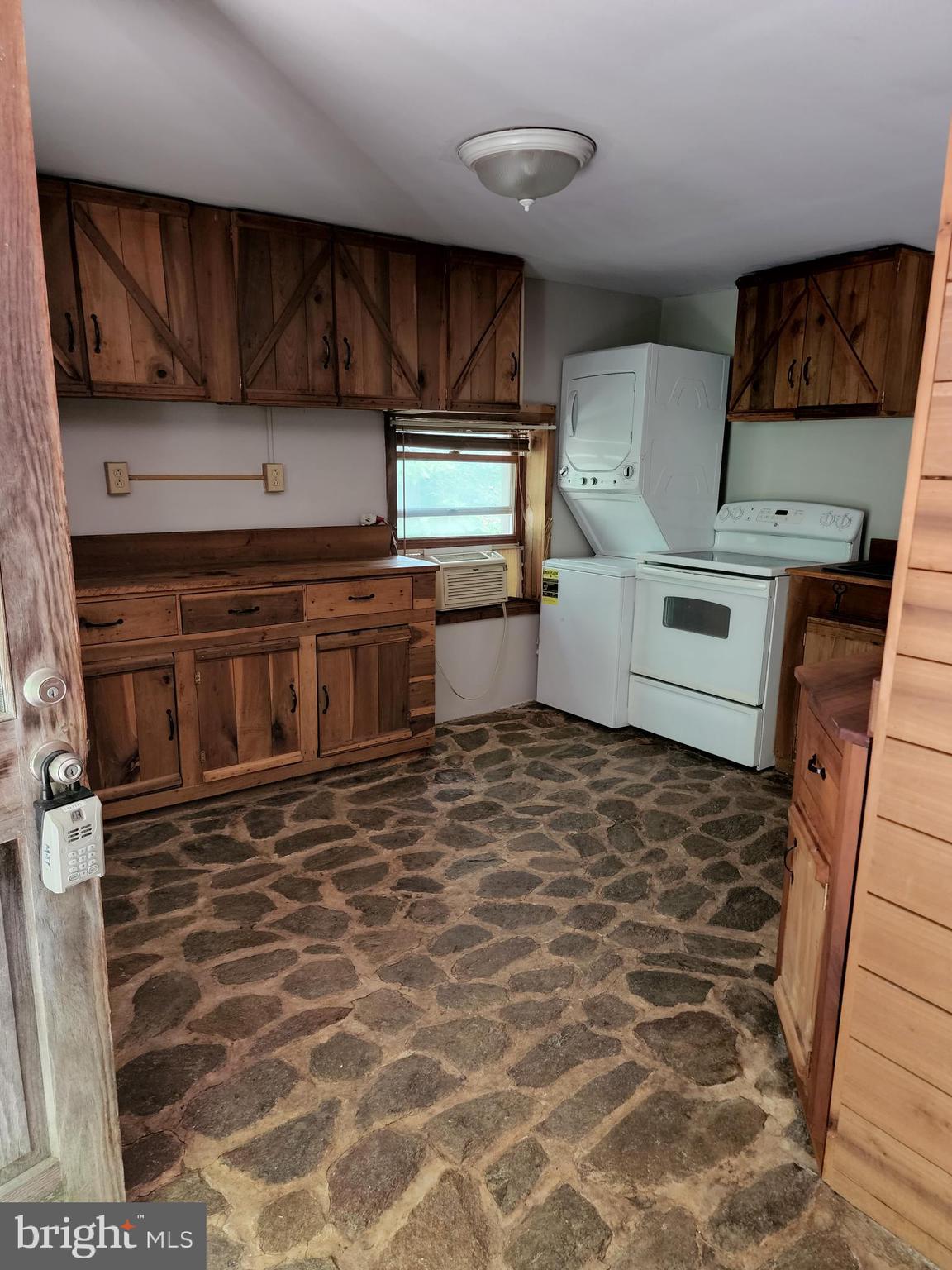 9625 Hoffman-Seachrist Road, Unit C Frederick, MD 21701 - Photo 3 of 3 a kitchen with stainless steel appliances granite countertop a stove a sink and a microwave