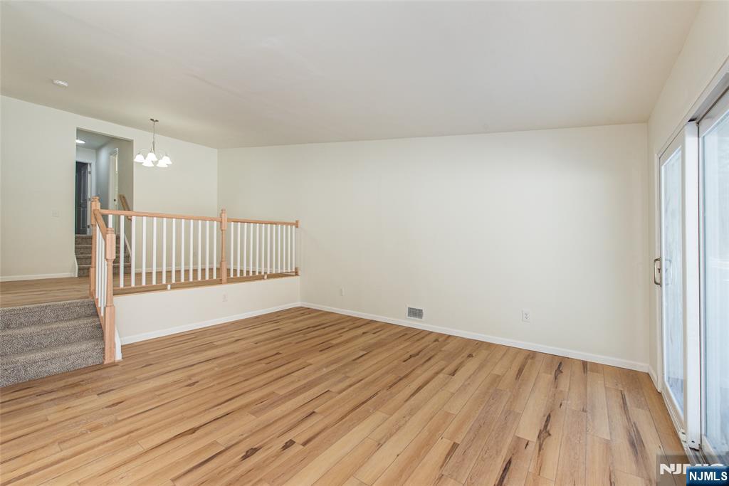 7 Summit Court Annandale, NJ 08801 - Photo 7 of 21 a view of an empty room with wooden floor