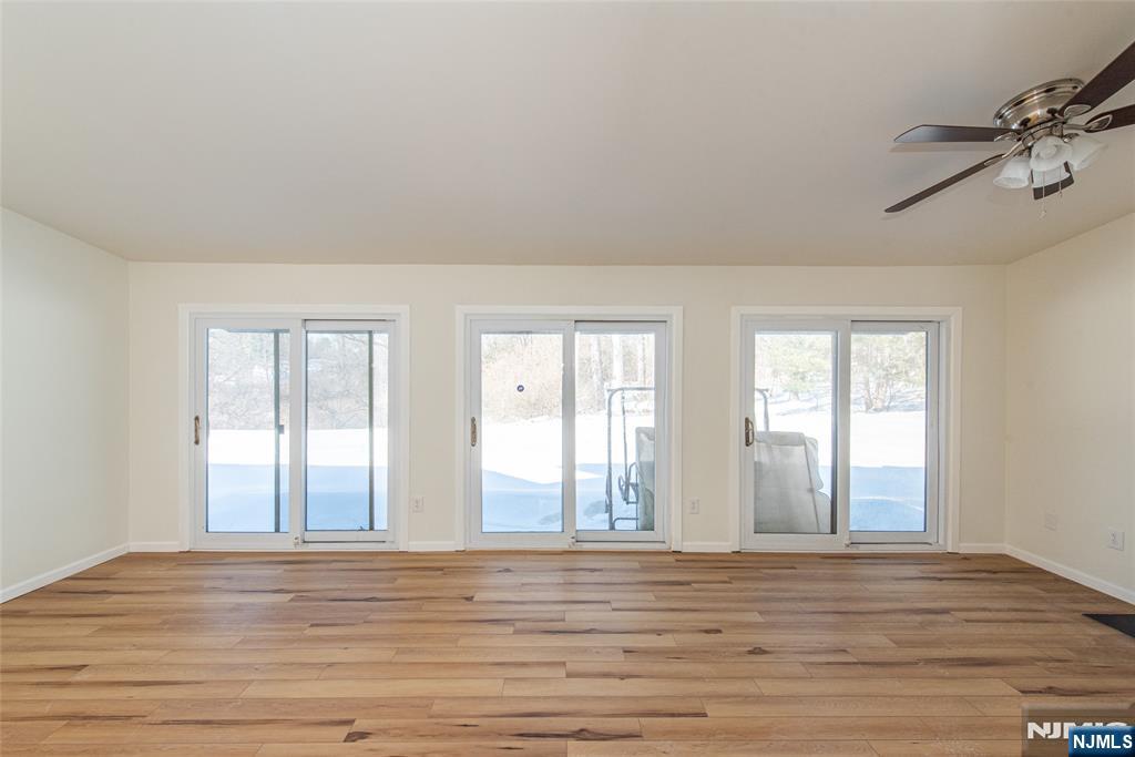 7 Summit Court Annandale, NJ 08801 - Photo 8 of 21 a view of empty room with wooden floor and fan