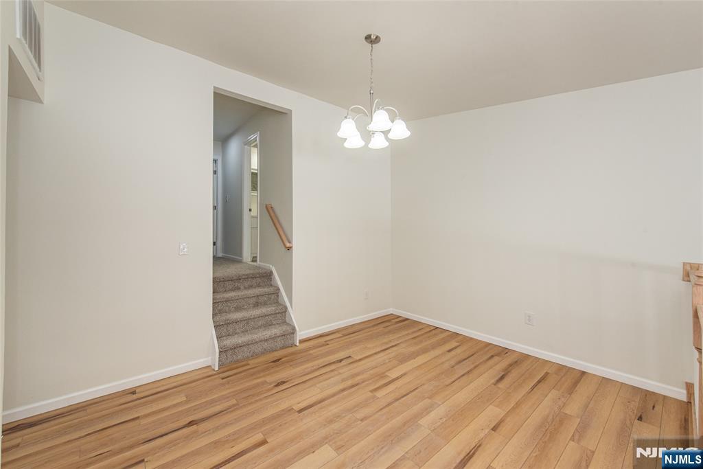 7 Summit Court Annandale, NJ 08801 - Photo 9 of 21 a view of a hallway with wooden floor and staircase