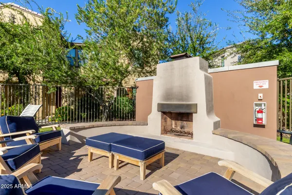 a view of a backyard with sitting area