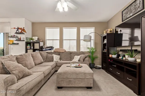 a living room with furniture fireplace and a flat screen tv