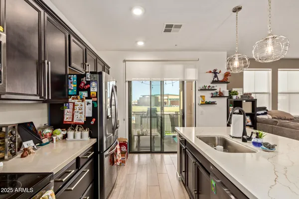 a kitchen with lots of counter top space and stainless steel appliances