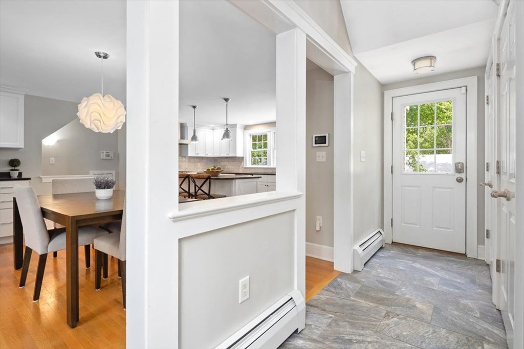 8 Merrymount Road Hingham, MA 02043 - Photo 18 of 34 a kitchen with stainless steel appliances granite countertop a stove and a refrigerator