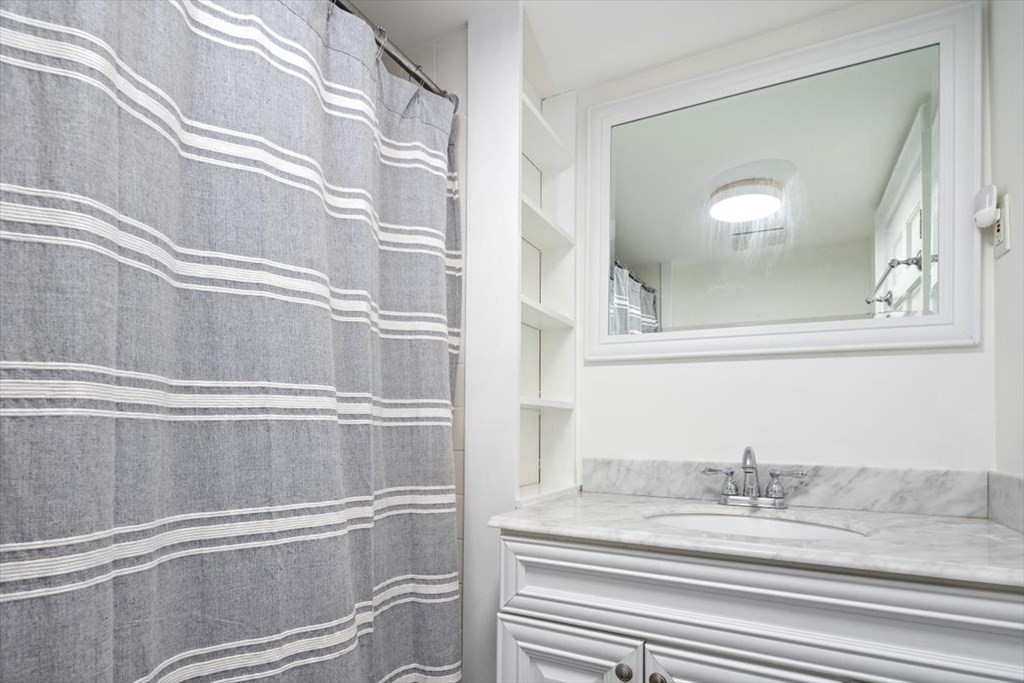 8 Merrymount Road Hingham, MA 02043 - Photo 25 of 34 a view of a kitchen from a hallway