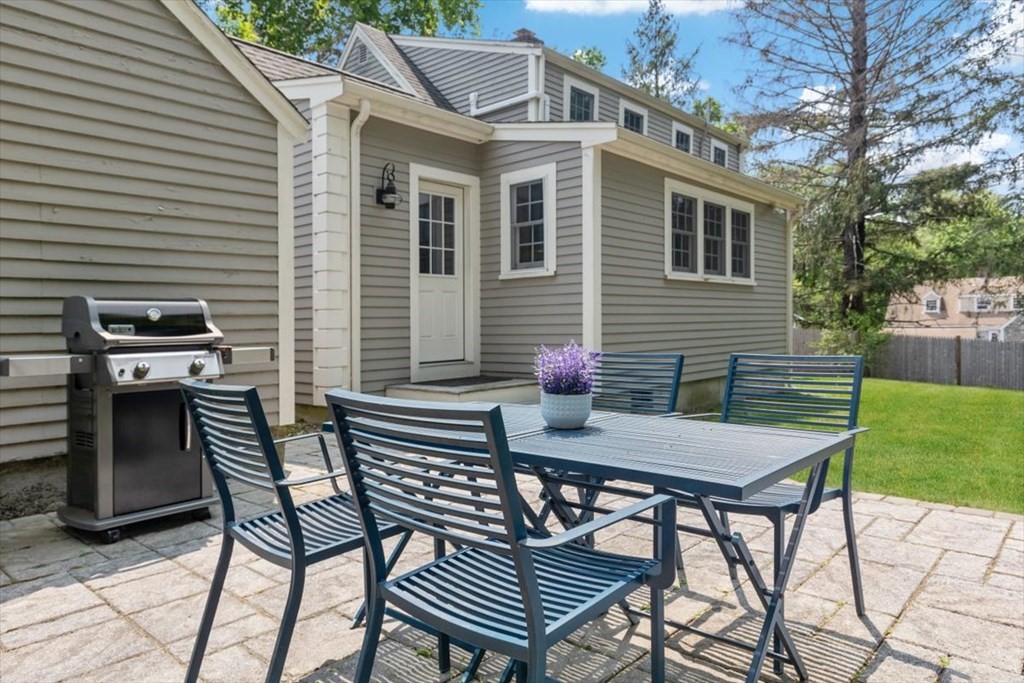 8 Merrymount Road Hingham, MA 02043 - Photo 33 of 34 a view of a patio with a table and chairs