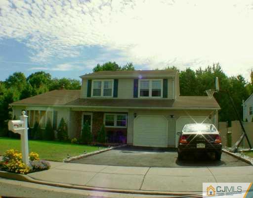54 Ridge Road Edison, NJ 08817 - Photo 1 of 6 a view of a car park in front of a house