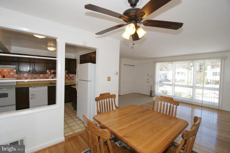 3520 Olympic Street Silver Spring, MD 20906 - Photo 11 of 24 a view of a dining room with furniture window and wooden floor