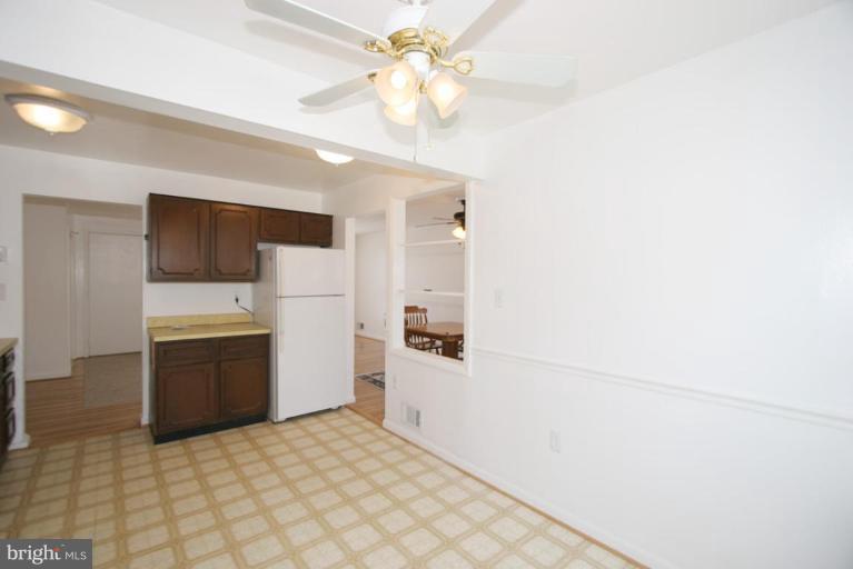 3520 Olympic Street Silver Spring, MD 20906 - Photo 20 of 24 a kitchen with a refrigerator and a stove top oven