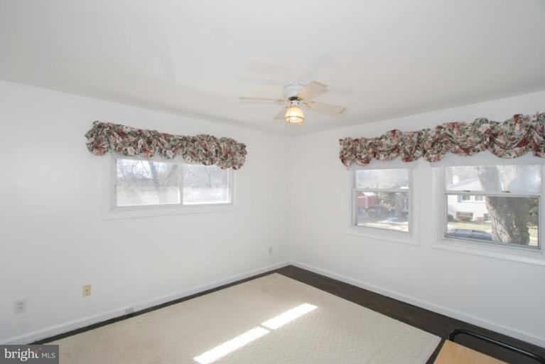 3520 Olympic Street Silver Spring, MD 20906 - Photo 3 of 24 a view of a small space with wooden floor and a window