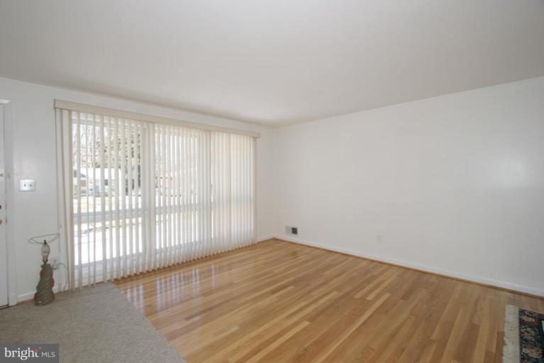 3520 Olympic Street Silver Spring, MD 20906 - Photo 21 of 24 wooden floor in an empty room with a window