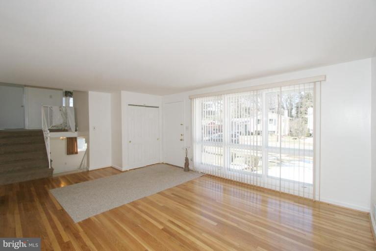 3520 Olympic Street Silver Spring, MD 20906 - Photo 22 of 24 a view of empty room with wooden floor and fan