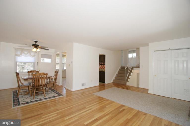 3520 Olympic Street Silver Spring, MD 20906 - Photo 23 of 24 a view of a livingroom with furniture and wooden floor
