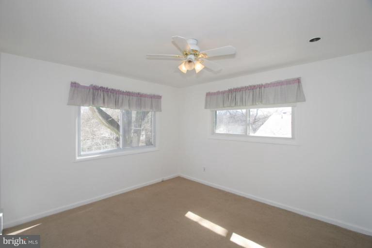 3520 Olympic Street Silver Spring, MD 20906 - Photo 4 of 24 a view of an empty room with a window
