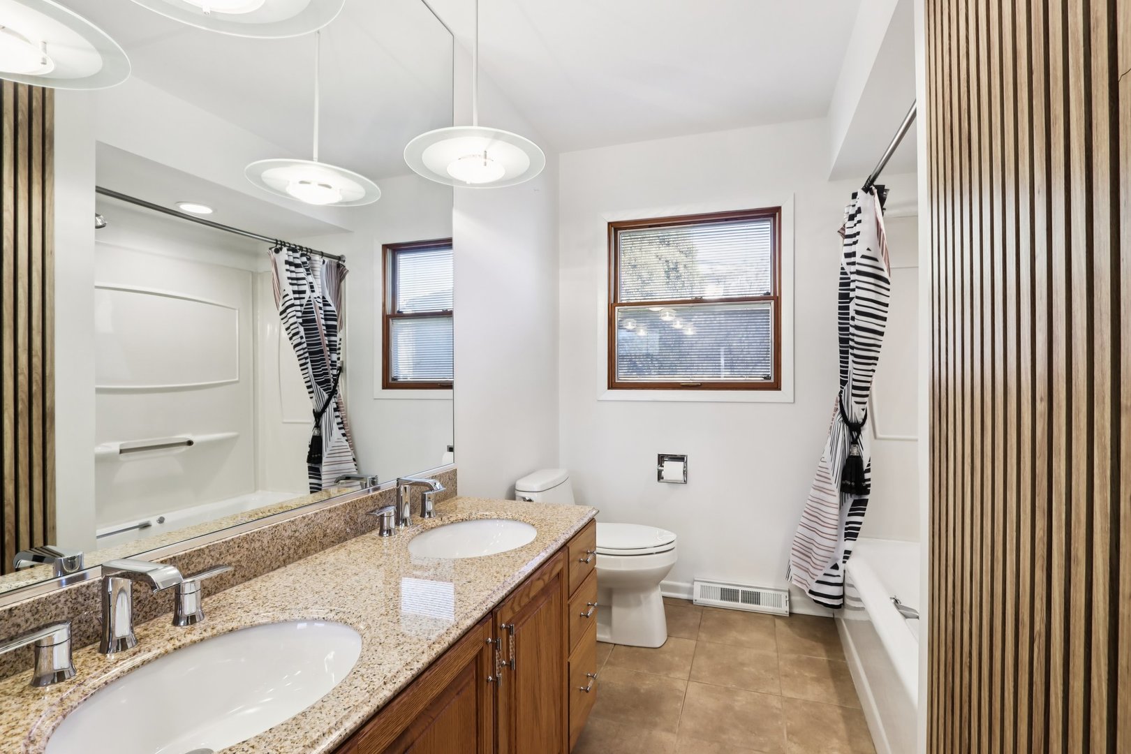 2019 East Avon Lane Arlington Heights, IL 60004 - Photo 15 of 58 a bathroom with a granite countertop sink toilet and a mirror