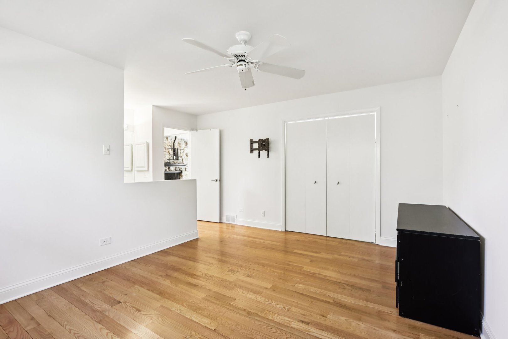 2019 East Avon Lane Arlington Heights, IL 60004 - Photo 18 of 58 a view of a livingroom with wooden floor and a ceiling fan